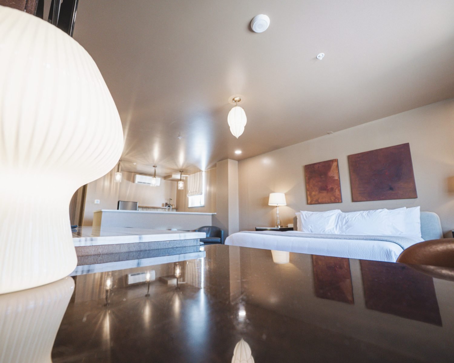 the-abbott-suite-lamp-bed-and-kitchenette-view-powerhouse-on-broadway