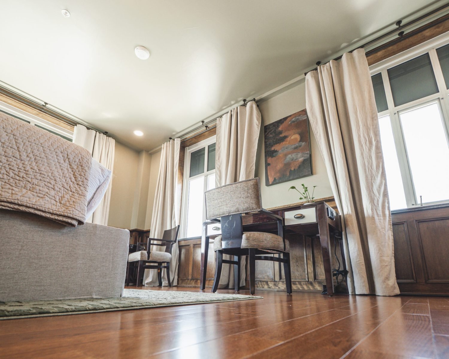 the-ford-suite-low-angle-view-of-bed-desk-artwork-large-windows-soft-green-walls-powerhouse-on-broadway