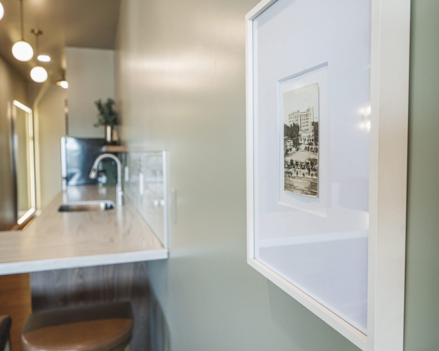the-ford-suite-vintage-hallway-photo-framed-artwork-kitchenette-soft-green-walls-powerhouse-on-broadway